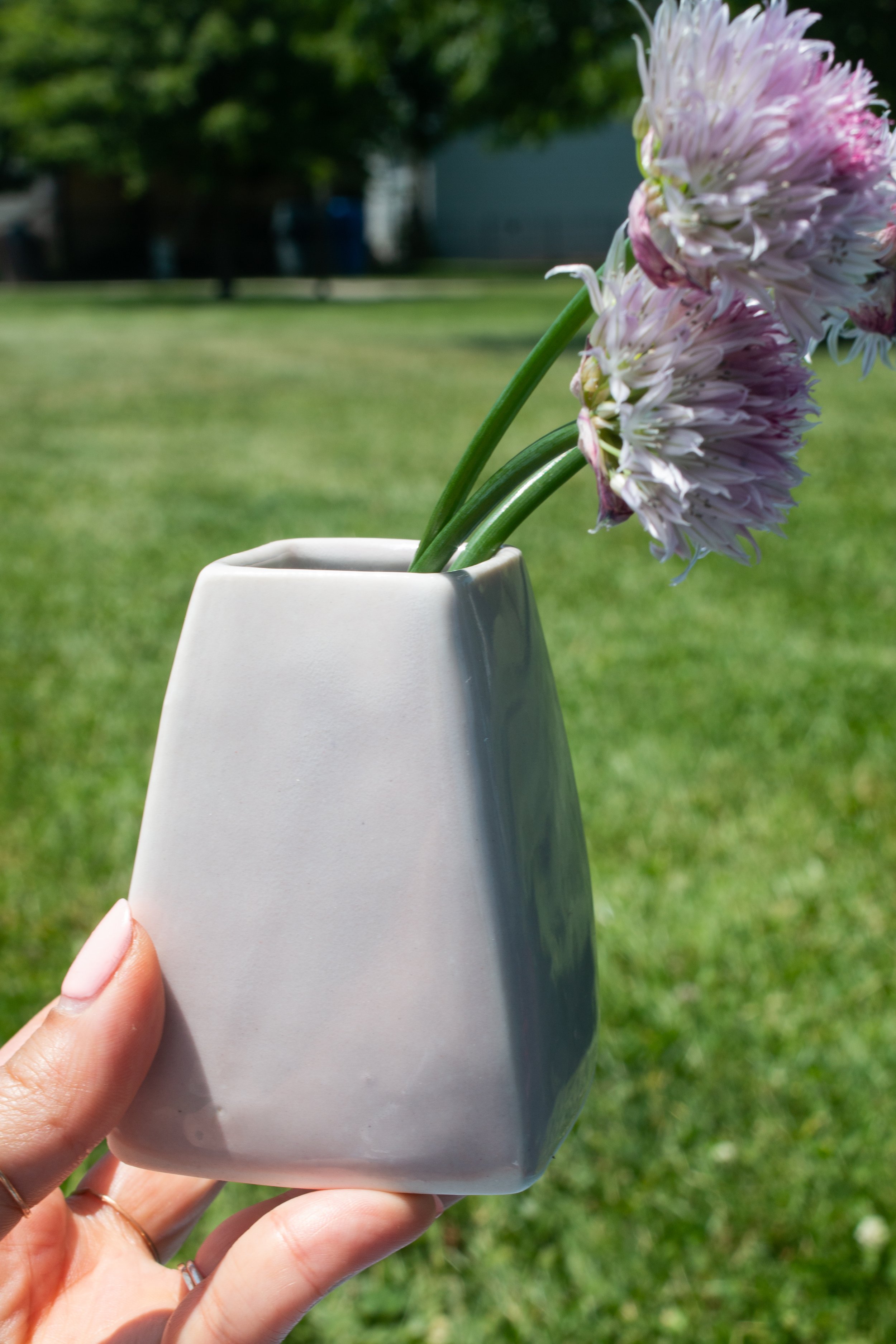  A small grey bud vase made by Lauren HB Studio for the summer pot collection available for purchase online 