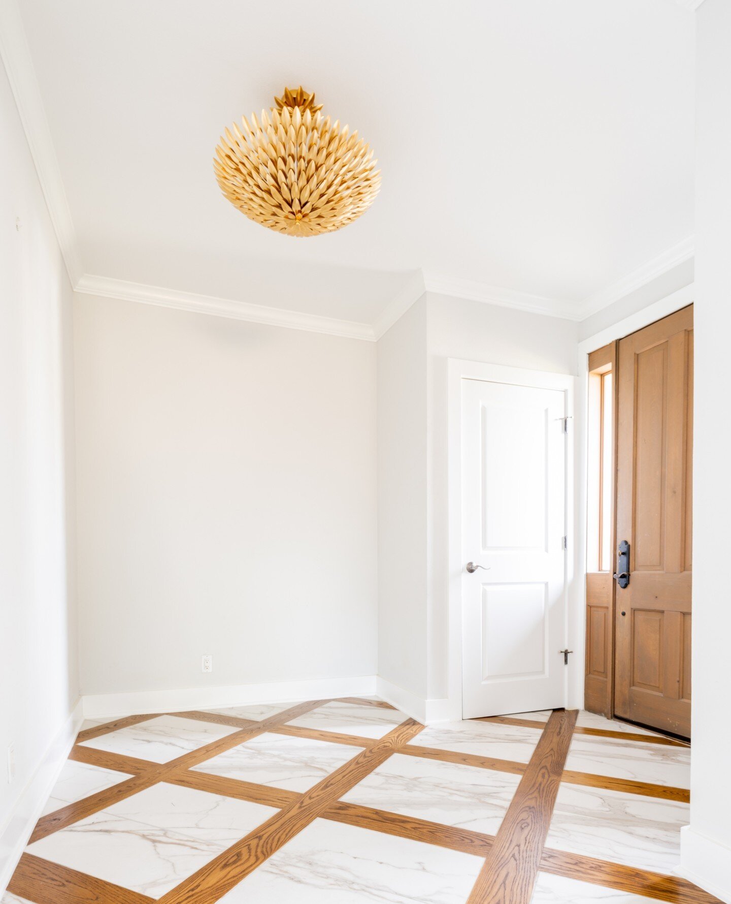 The chandelier, the marble floor with the stunning wood in-lay, what is there not to love about this charming front entry! With a few key design details and a fresh coat of paint, we created a warm and welcoming first impression for this gorgeous hom