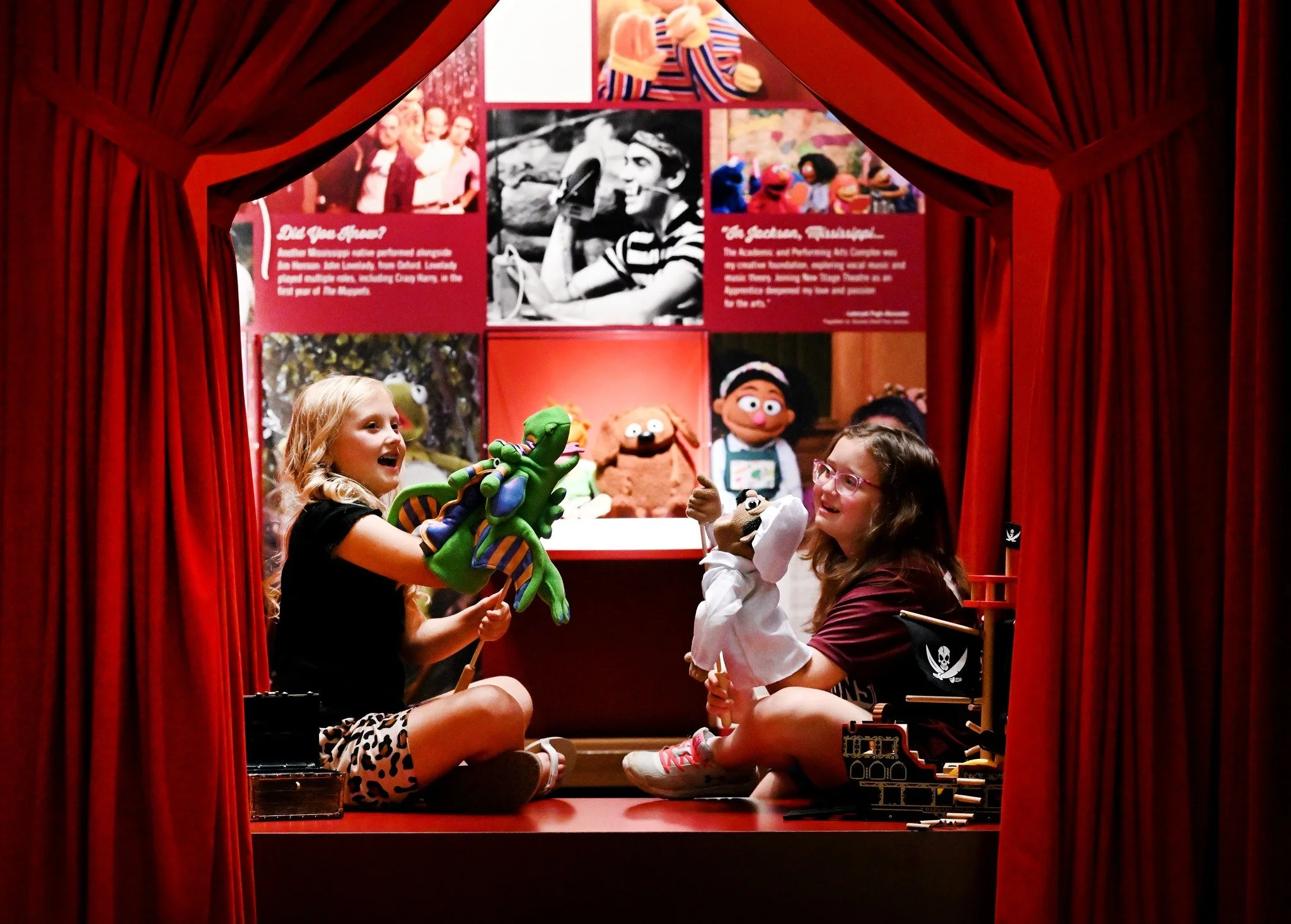 kids playing in the new puppet theatre