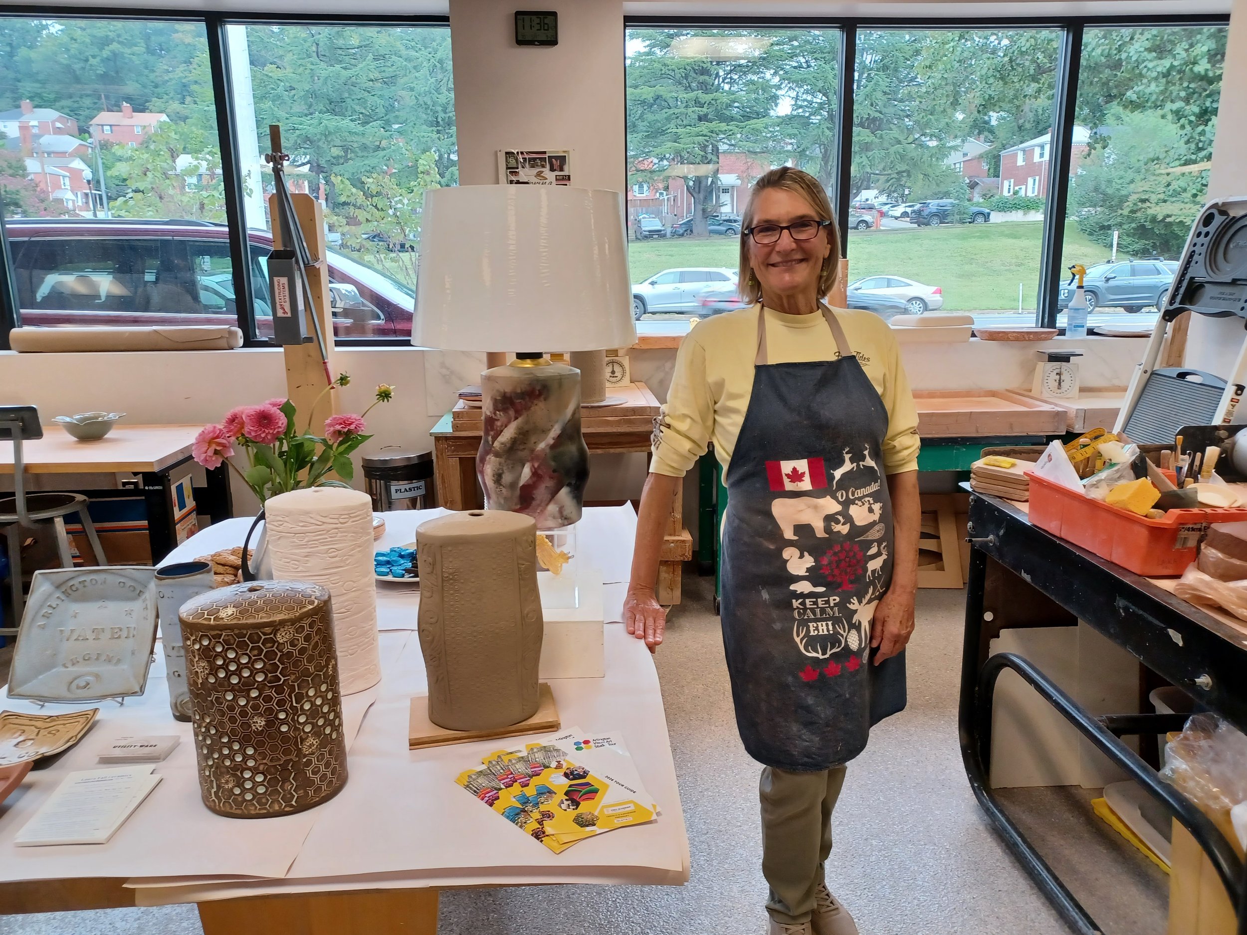 Laura Fall showing off the new Arlington ceramics studio