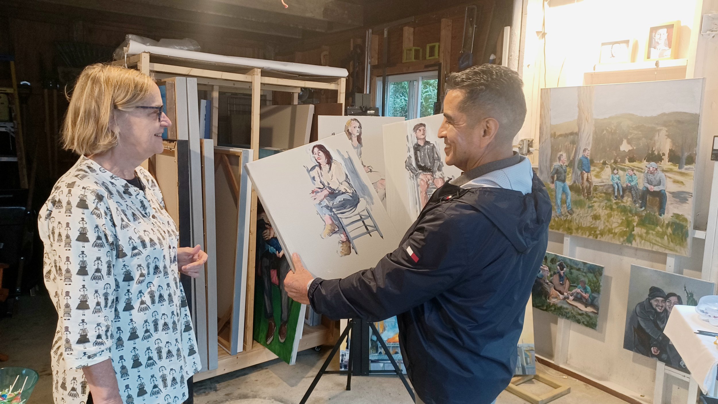 Miguel Espinosa showing his day's work to Beth Rhyne