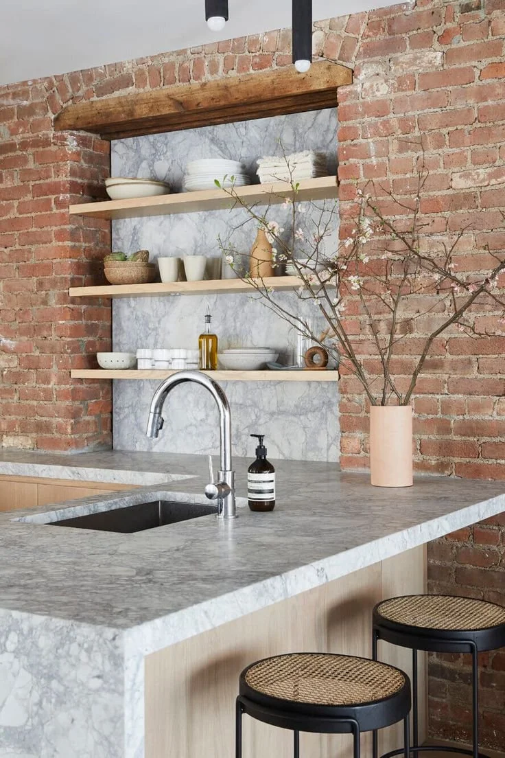 A SoHo Loft with Exposed Brick and Subtle Color Touches.jpg