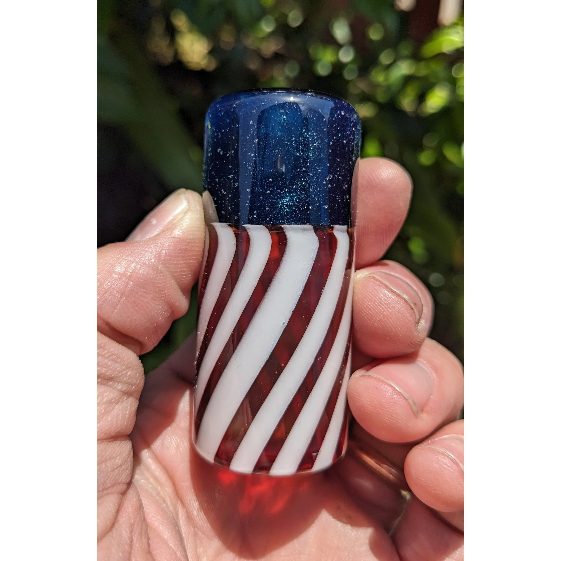 Close-up of The Liberty Slide #1, limited-run red white and blue Silica Sound glass guitar slide