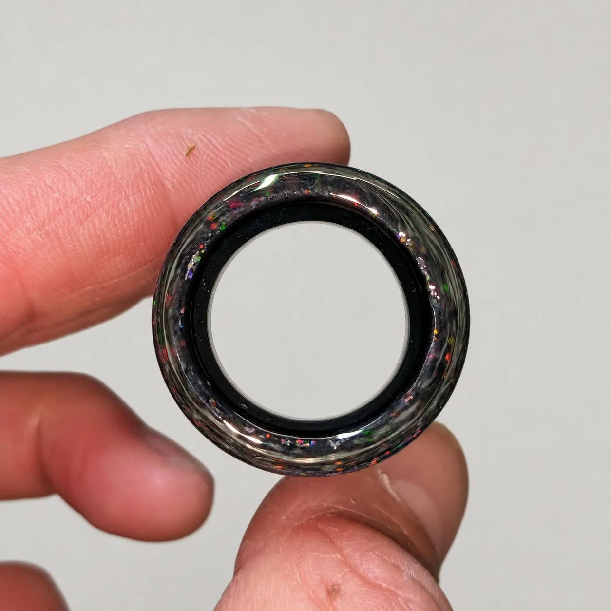 End view of Crushed Opal #1 non-tapered glass guitar slide showing the inner diameter and heavy wall