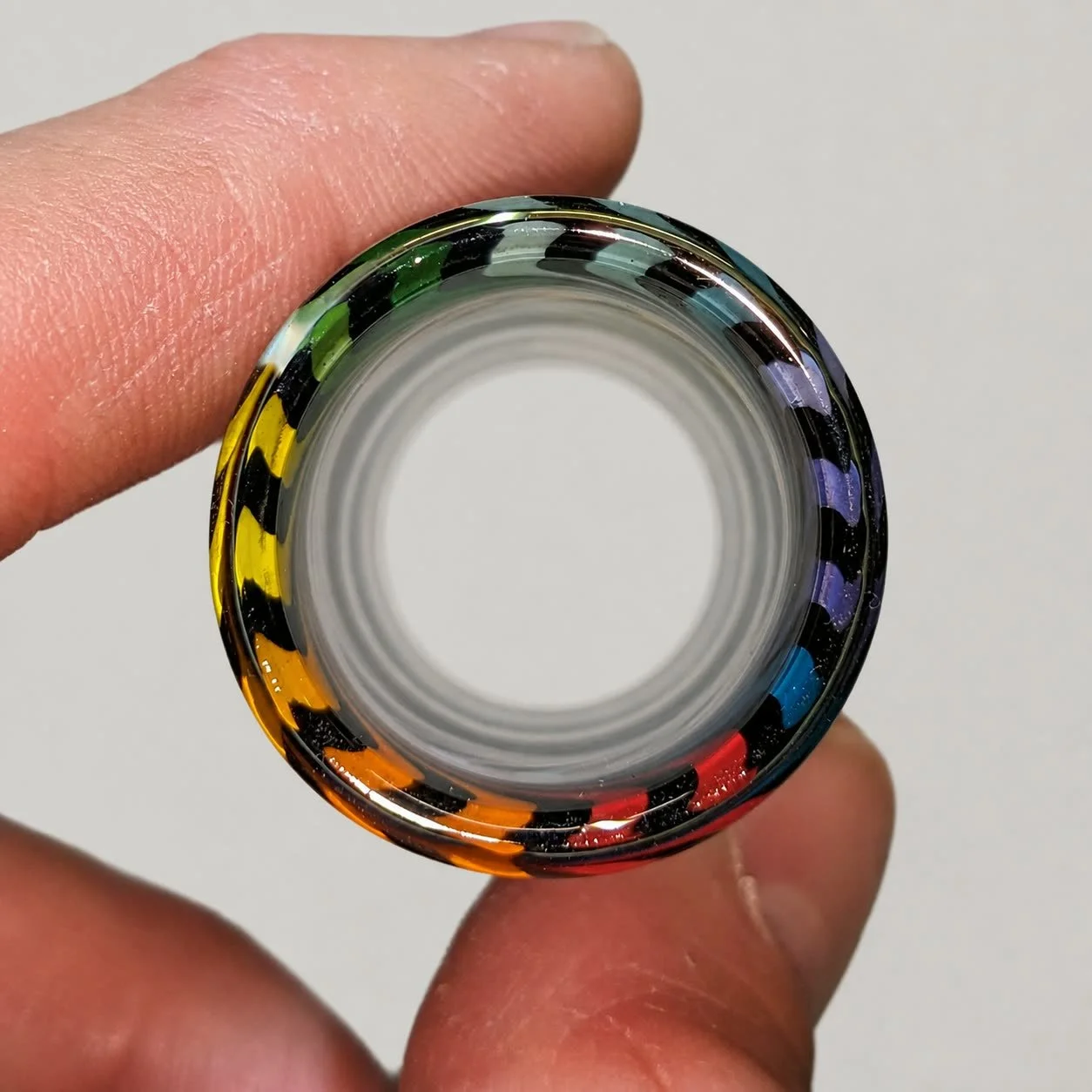 End view of Rainbow Wig Wag non-tapered glass guitar slide showing its opening and wall