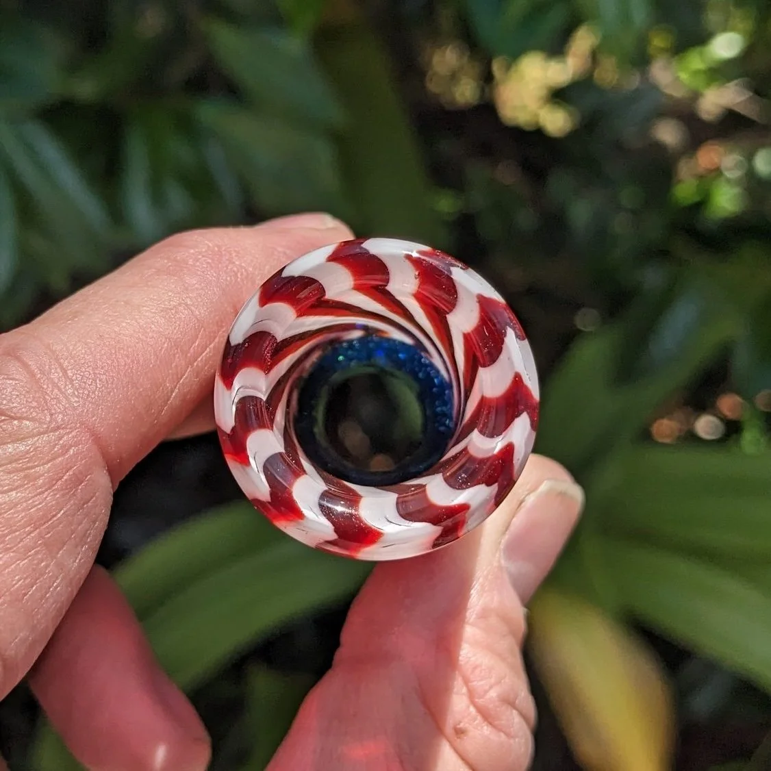 Striped end view of The Liberty Slide #1, red and white handmade glass guitar slide