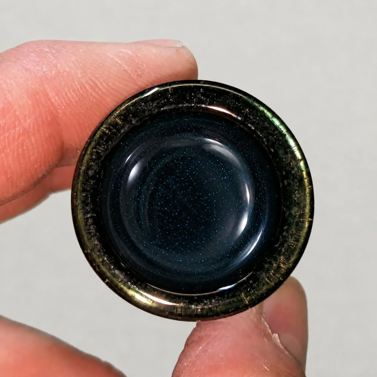 Interior view of Blue Sparkle Ball Tip glass guitar slide showing the heavy wall and rounded closed end
