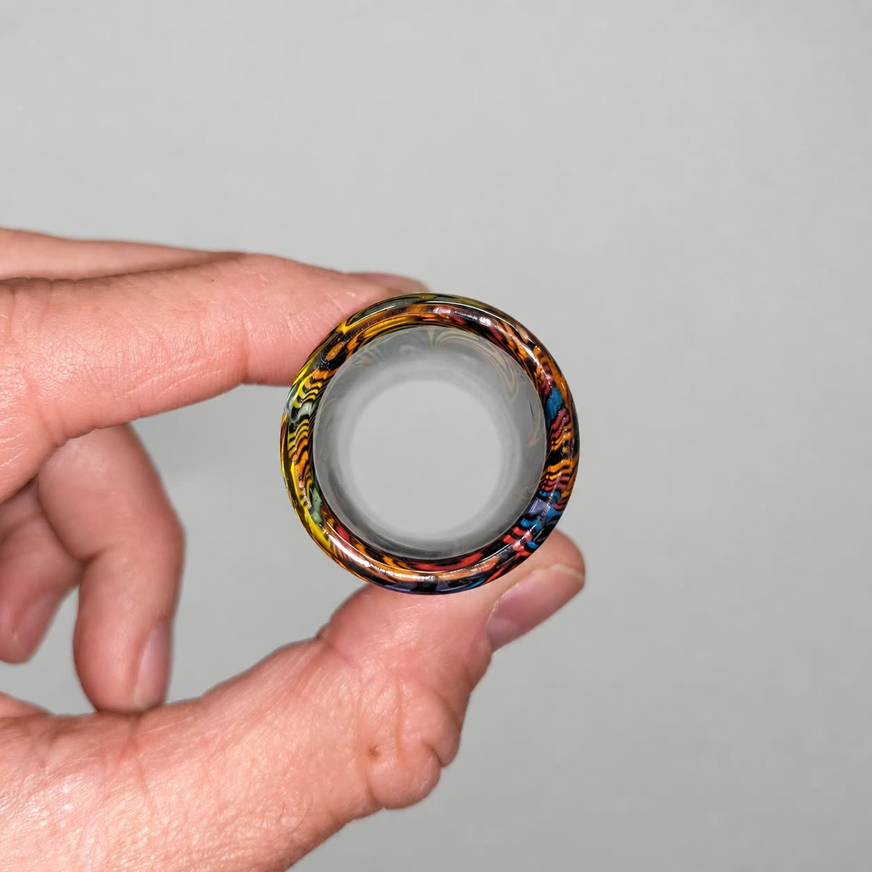 End view of Rainbow Spiral handmade glass guitar slide showing its non-tapered opening and medium wall