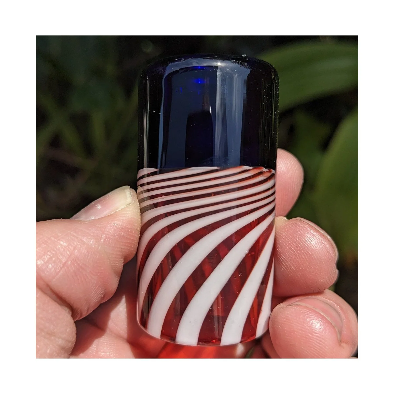 Close-up of The Liberty Slide #3, limited-run red white and blue Silica Sound glass guitar slide