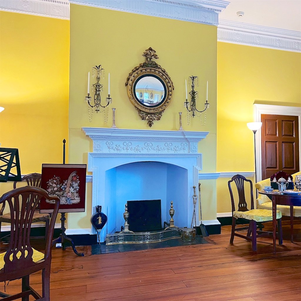The style of the Withdrawing Room/Ballroom is neoclassical - a simpler and more linear version of classicism than the Rococo detailed dining room. There is a faux door to the right to maintain the design symmetry of the fireplace wall.