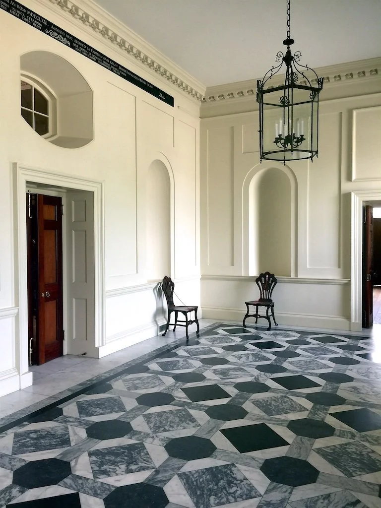
Tryon Palace Entry Hall: Tryon Palace was completed in 1770. A lot of design is pulled directly from the fine homes of London and the country. The house reflects Georgian architecture, interiors, and their passion for classical elements and symmetry