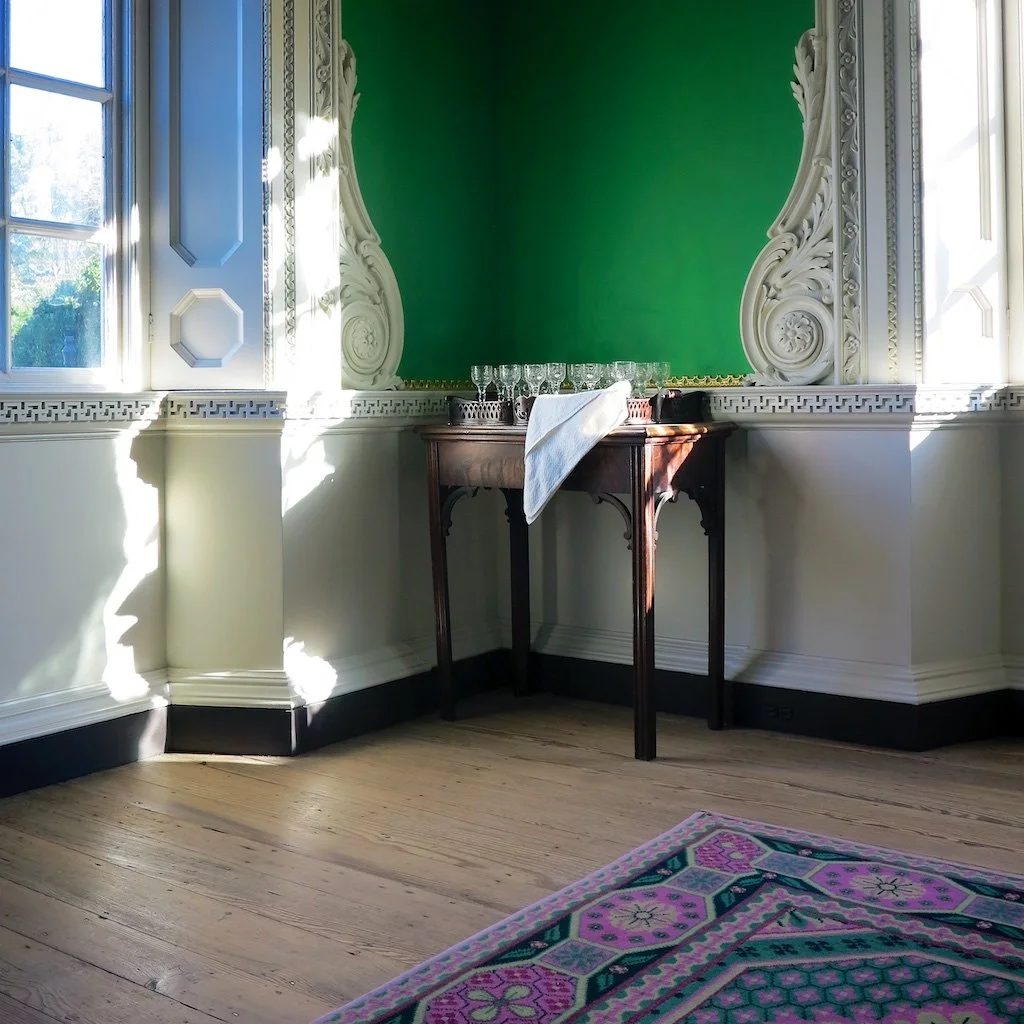 Supper Room: The adjoining Supper Room features Chinese-inspired woodwork, "Green verditer" walls, and patterned wool carpet. 