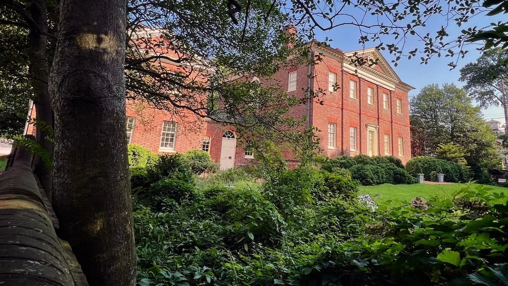 The entire house is laid in a brickwork pattern called FLEMISH BOND: a stretcher (or long side of brick) alternates with a HEADER (the short side of a brick). Flemish bond was prized for both its beauty and the strength created by the interlocking br