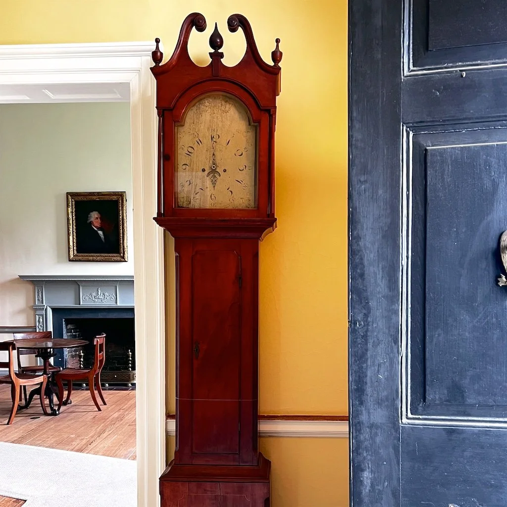 Central Hall Front Entry: At the front entry, a Philadelphia tall case Federal mahogany grandfather's clock looking into the Family Parlor at Woodlawn.