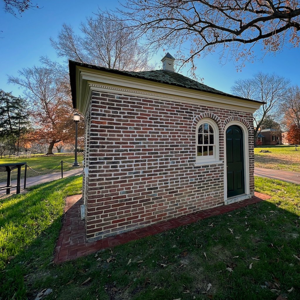 Homewood Privy: The privy for Homewood with paneled walls and dome ceiling..