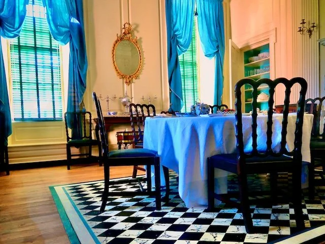 The beautiful early morning sunlight illuminates what is usually a dark dining room..