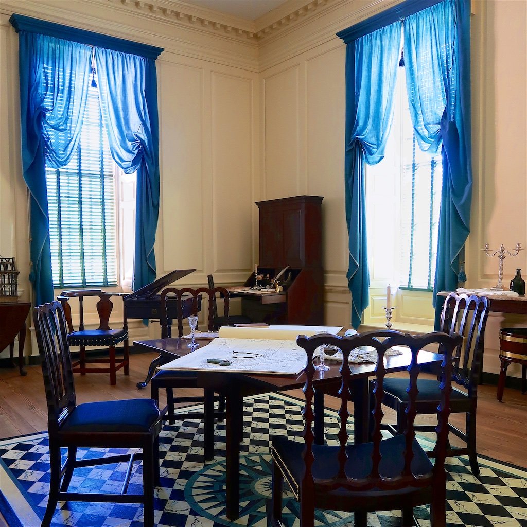 
Dining Room: How the room was used varied as to what was needed. This presentation shows the room used for a meeting. This is one of the outstanding examples of reconstructed paneling in the Palace. 