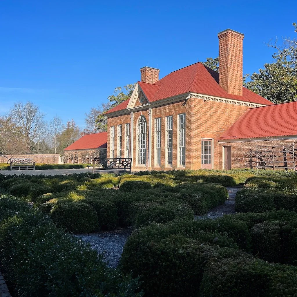 Upper Garden: One of two formal boxwood parterres. The greenhouse is the Upper Garden's architectural centerpiece and contains more exotic plants, including lemon and orange trees.