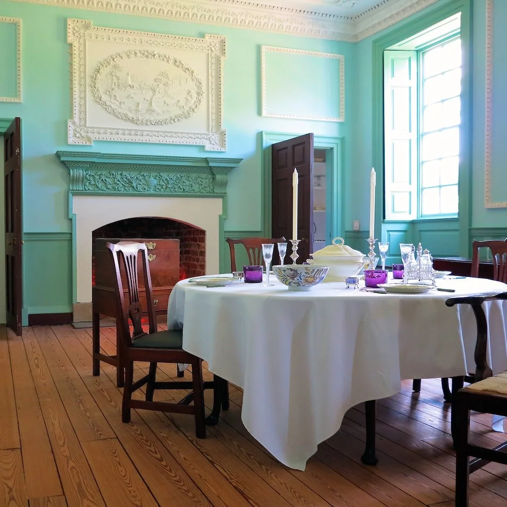 Dining Room: The scene above the fireplace in the dining room is of Aesop's Fable of "The Fox and the Crow." All plaster molding (fireplace mantles included) was either cast or carved in place. T