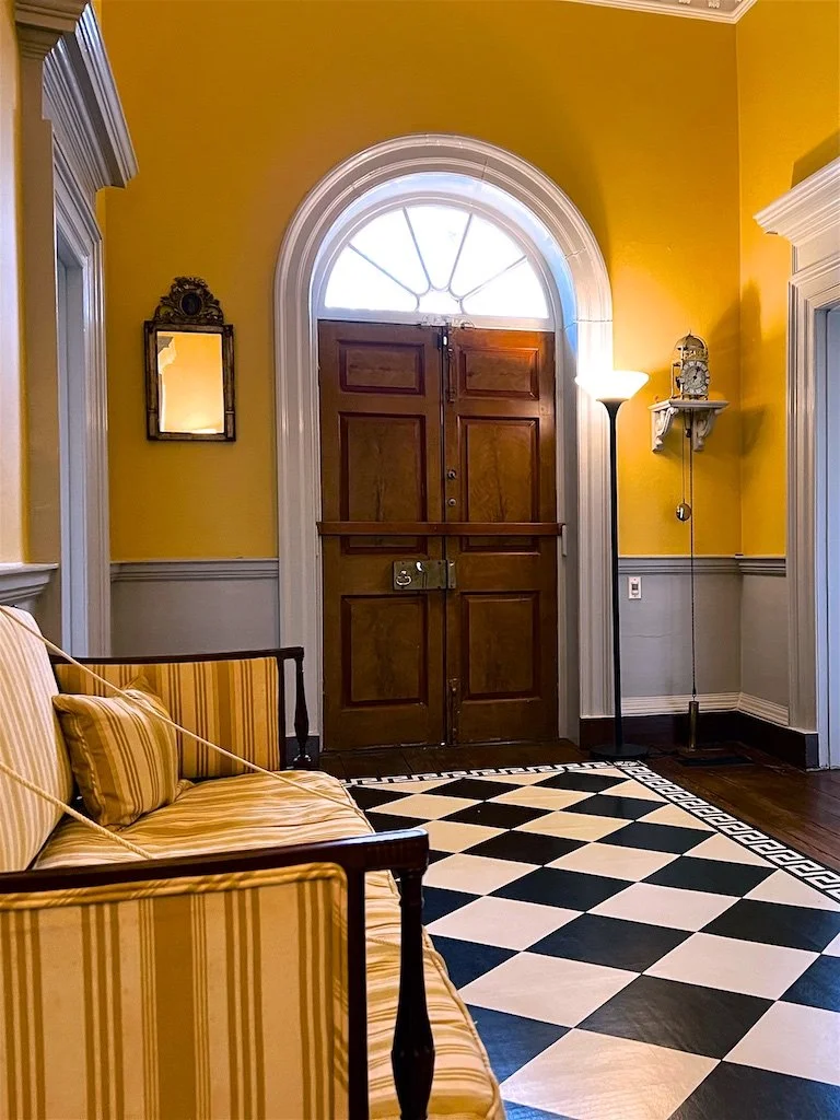 Central Passage: Guests to the house would have entered here in the central passage. Depending on your social status and the purpose of your visit, you might be asked to take a seat here or be invited into the parlor or dining rooms at the back of th