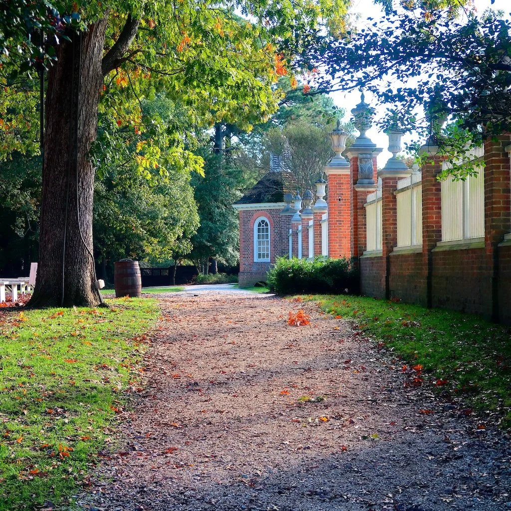 The north end of the formal gardens with open spaces beyond that is part of the long vista from the Governor's Palace.