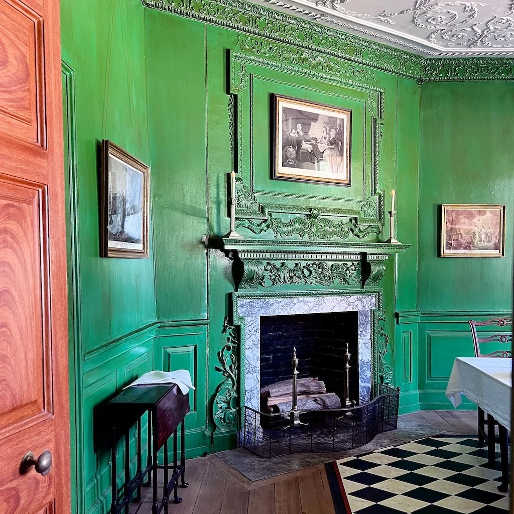 The Dining Room: Part of the original house was built in 1734. Previously red, in 1785, adapting the "mode" arriving from London - the verdigris-green paint was added.