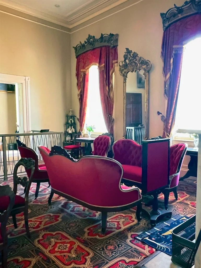 White Parlor: Robert E. Lee originally purchased the red velvet furniture for his West Point superintendent's quarters.