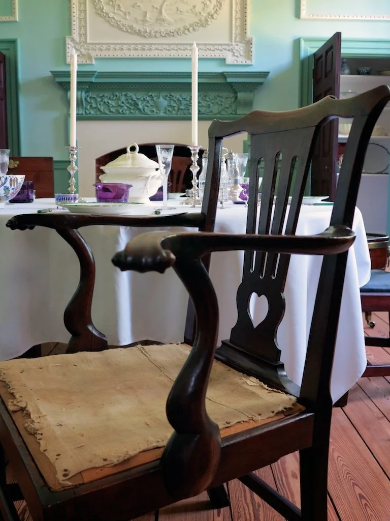 One of six Chippendale style mahogany dining room chairs with a matching arm chair. 