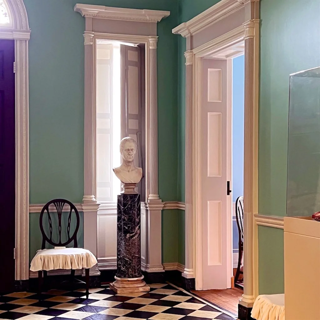 Homewood Reception Hall: Painted floor cloths or richly detailed rugs cover the original southern yellow pine floors.
