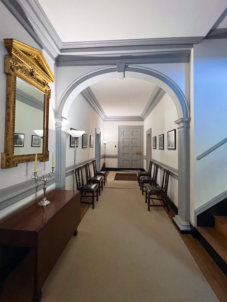 The interior plan of the house utilizes a central passage, which runs the full depth of the house.