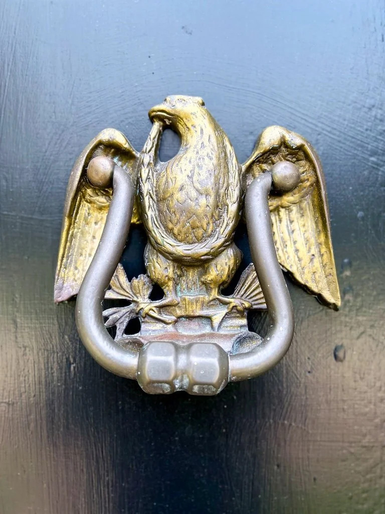 Central Hall Front Door: A brass eagle door knocker at the front entry reflects the strong Washington family connection to Woodlawn.