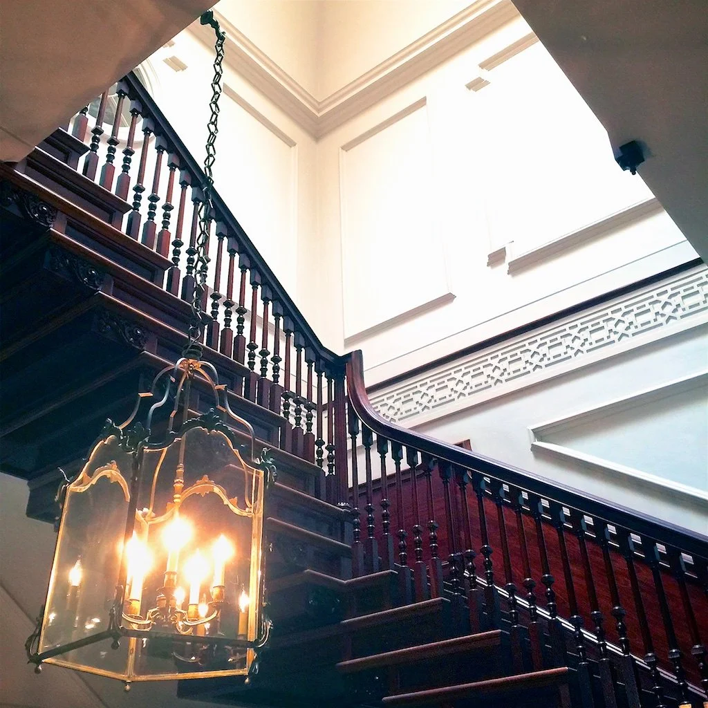 Grand Staircase: Cantaleviered mahogany Grand Staircase - a costly focal point illustrating the extravagant cost that created the "Palace" nickname and required the Governor to raise taxes to pay for it.