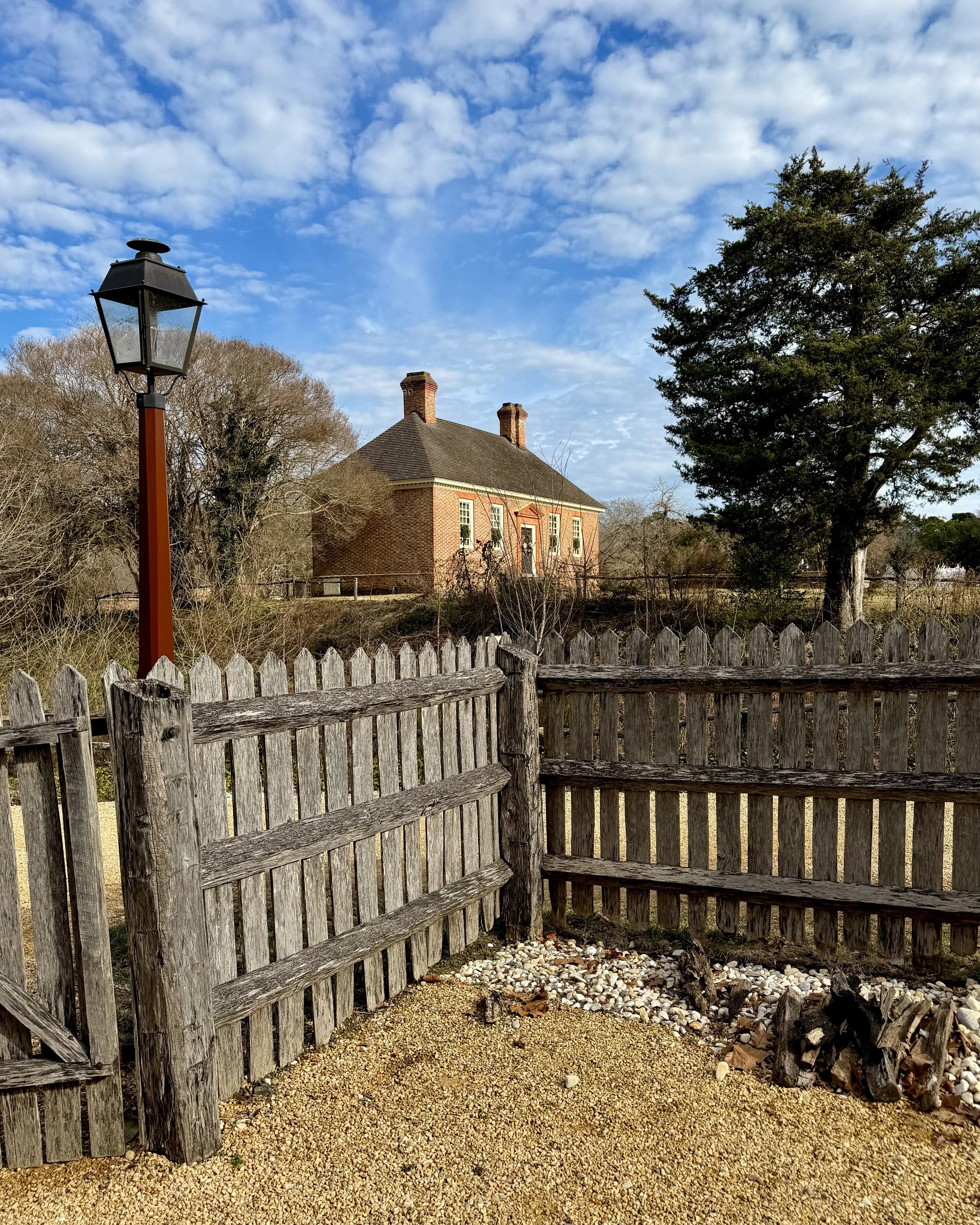 An unusual view of the Secretary's Office Building of the Capital from a back doorway in Colonial Williamsburg.