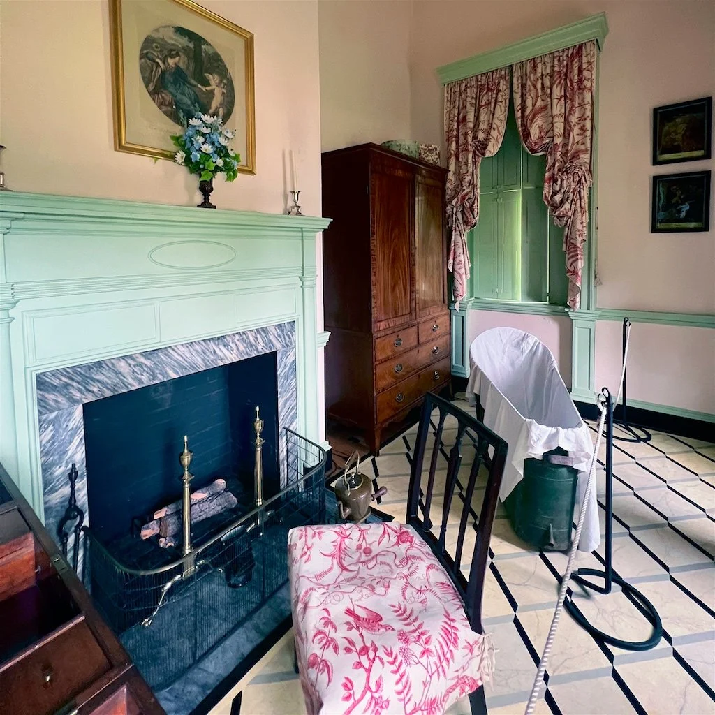 Dressing Room: The dressing room for the primary bedroom includes a portable bathtub that was part of the period.