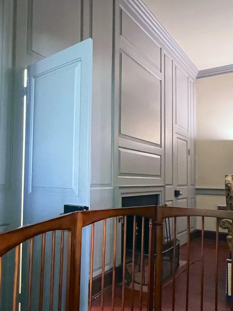 Second-Floor Bed Chamber: A simpler cornice and chair rail from those in the more formal downstairs—this room features a hidden paneled door leading to the service stairs.
