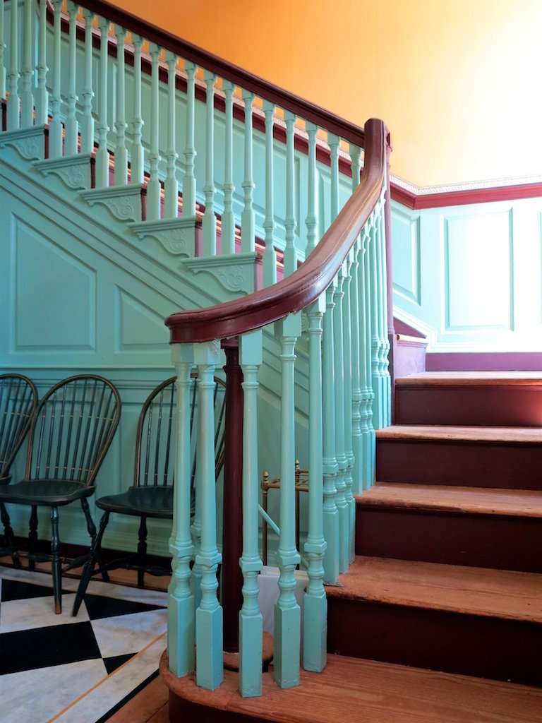 Kenmore first floor entry hall and staircase: The house has been restored inside by painstaking paint and wallpaper analysis. 