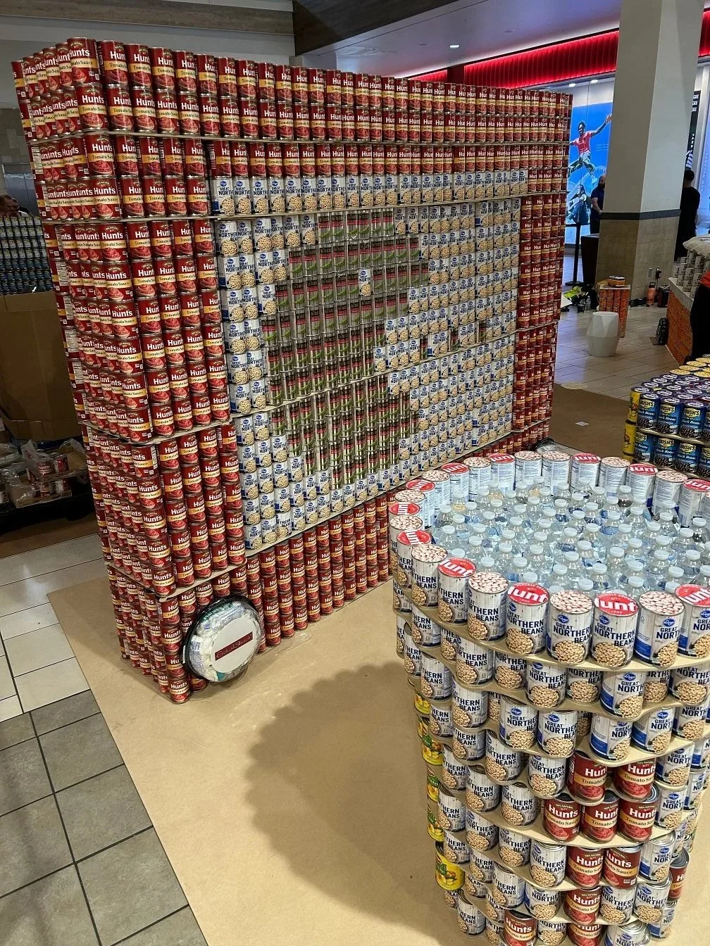 Cans stacked to create a sculpture of a pacman game