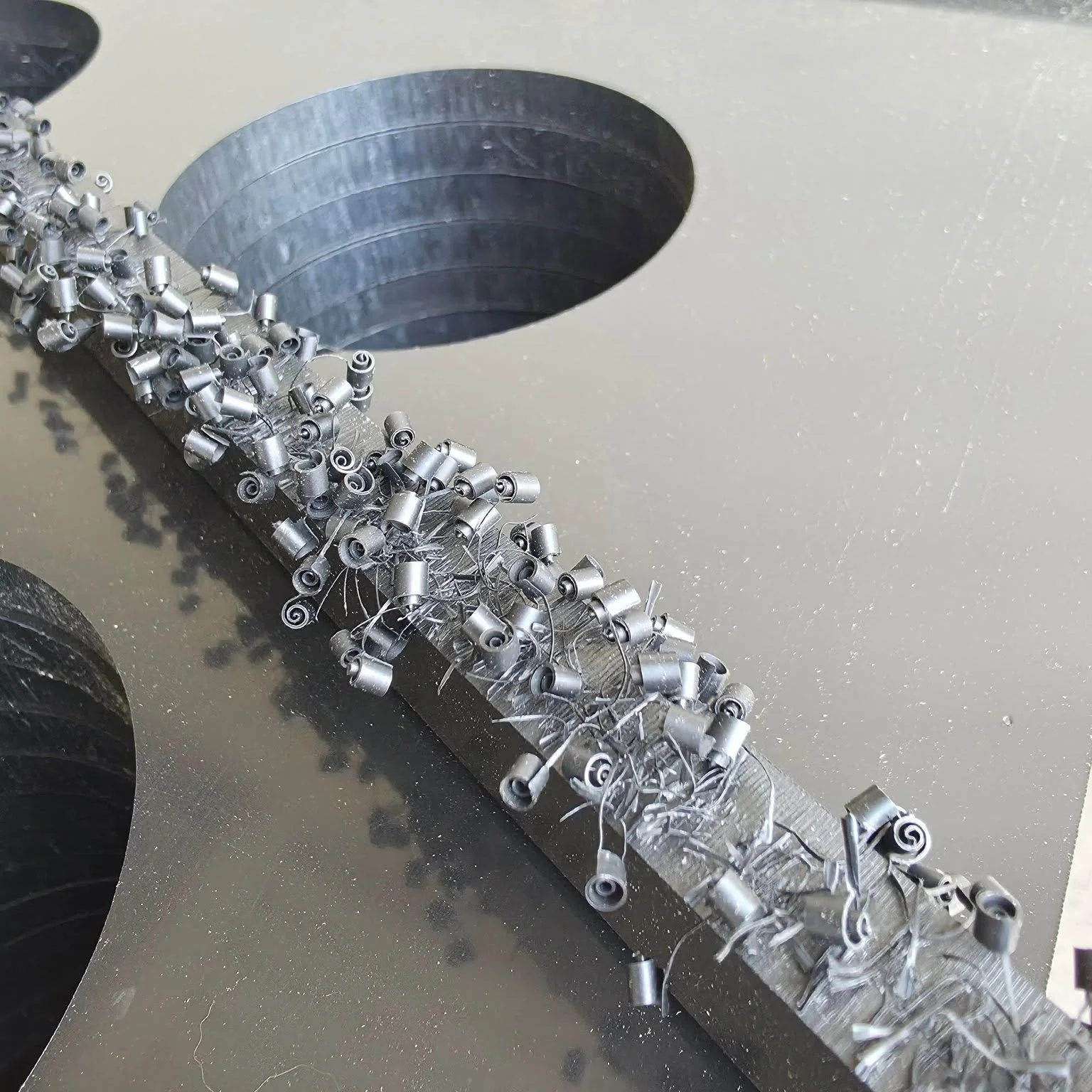Check these out!

Here are some "Happy Little Accidents" the machines made while cutting HDPE plastic during  a recent job. These were interesting and repeatable little patterns in the scrap based on the movements of the bits. We couldn't h