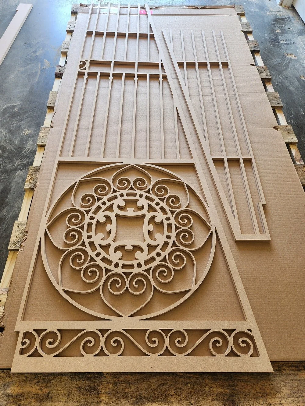 A sheet of MDF cut in a lattice shape.