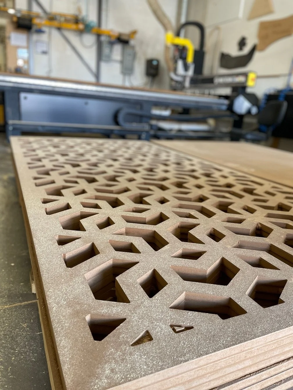 A wood panel with lattice cutouts