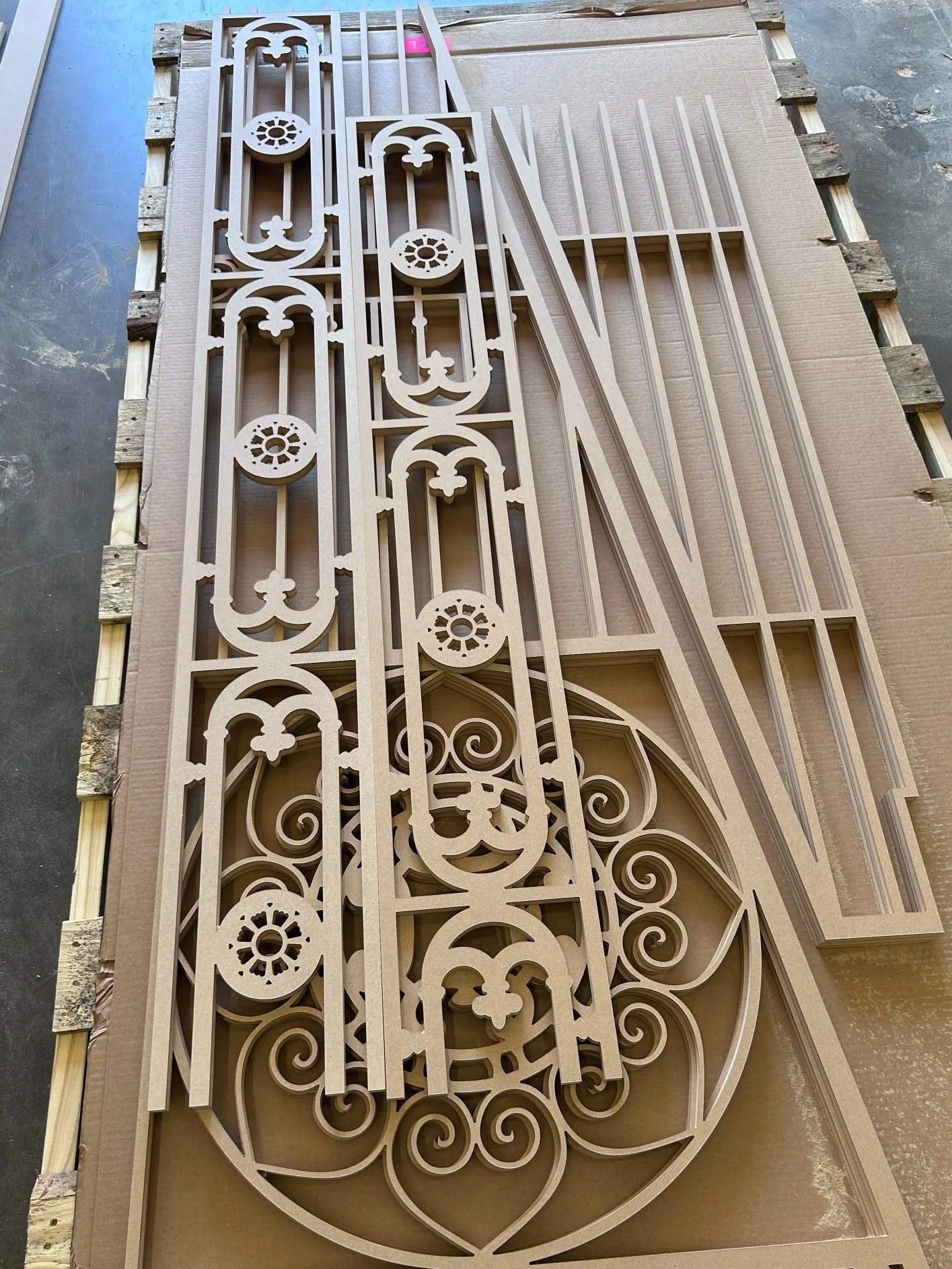 A sheet of MDF cut in an intricate lattice design