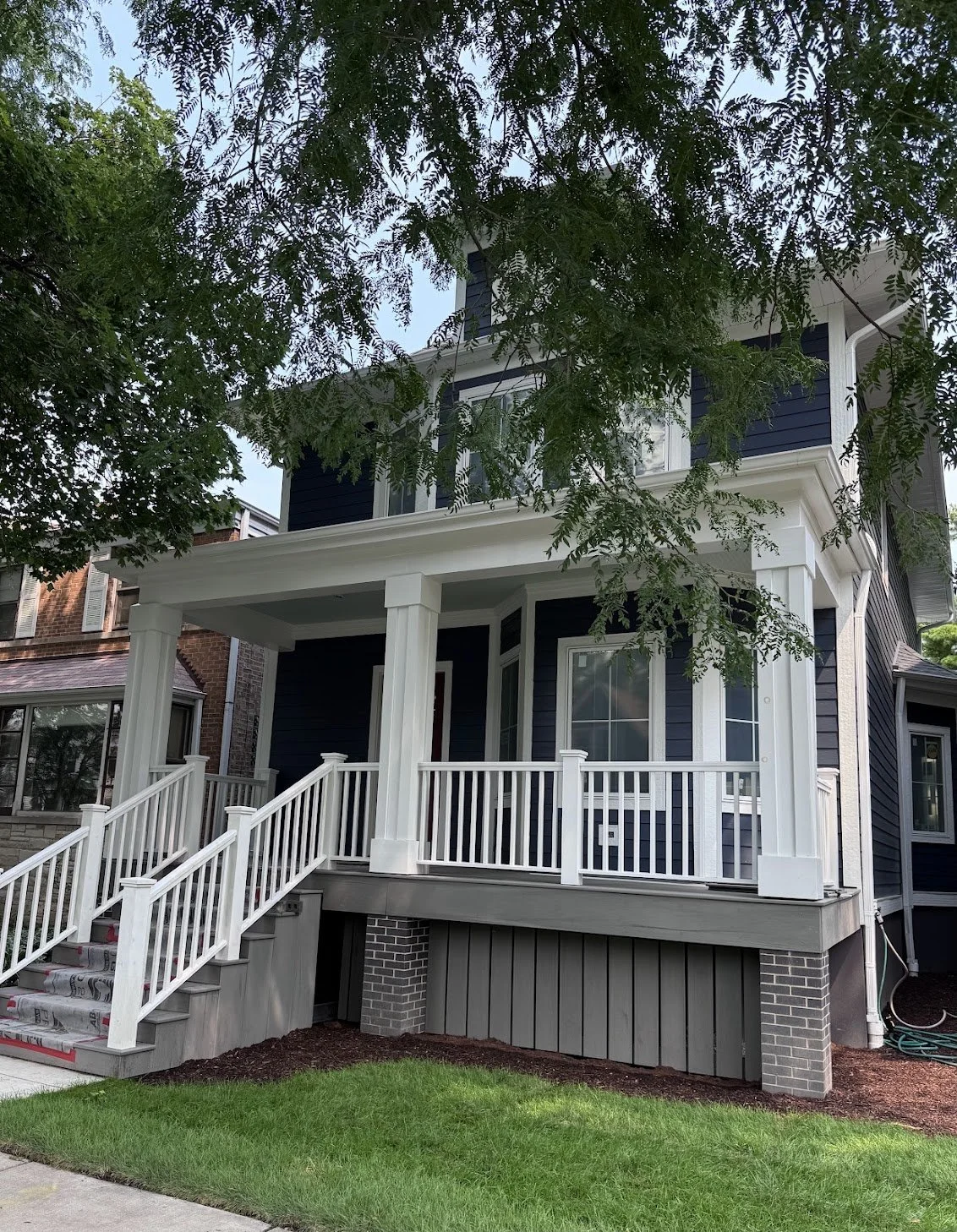 4419 N. Spaulding, Navy blue house, white trim