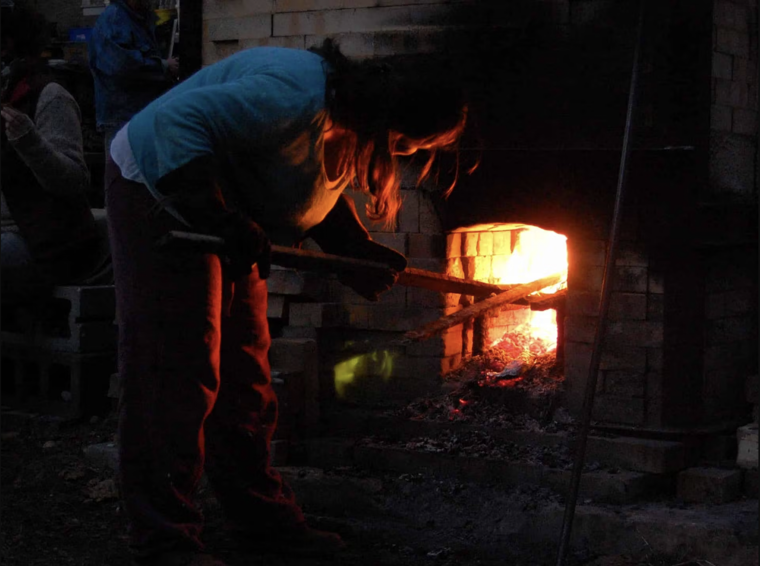 Yellow Springs stoking kiln.png