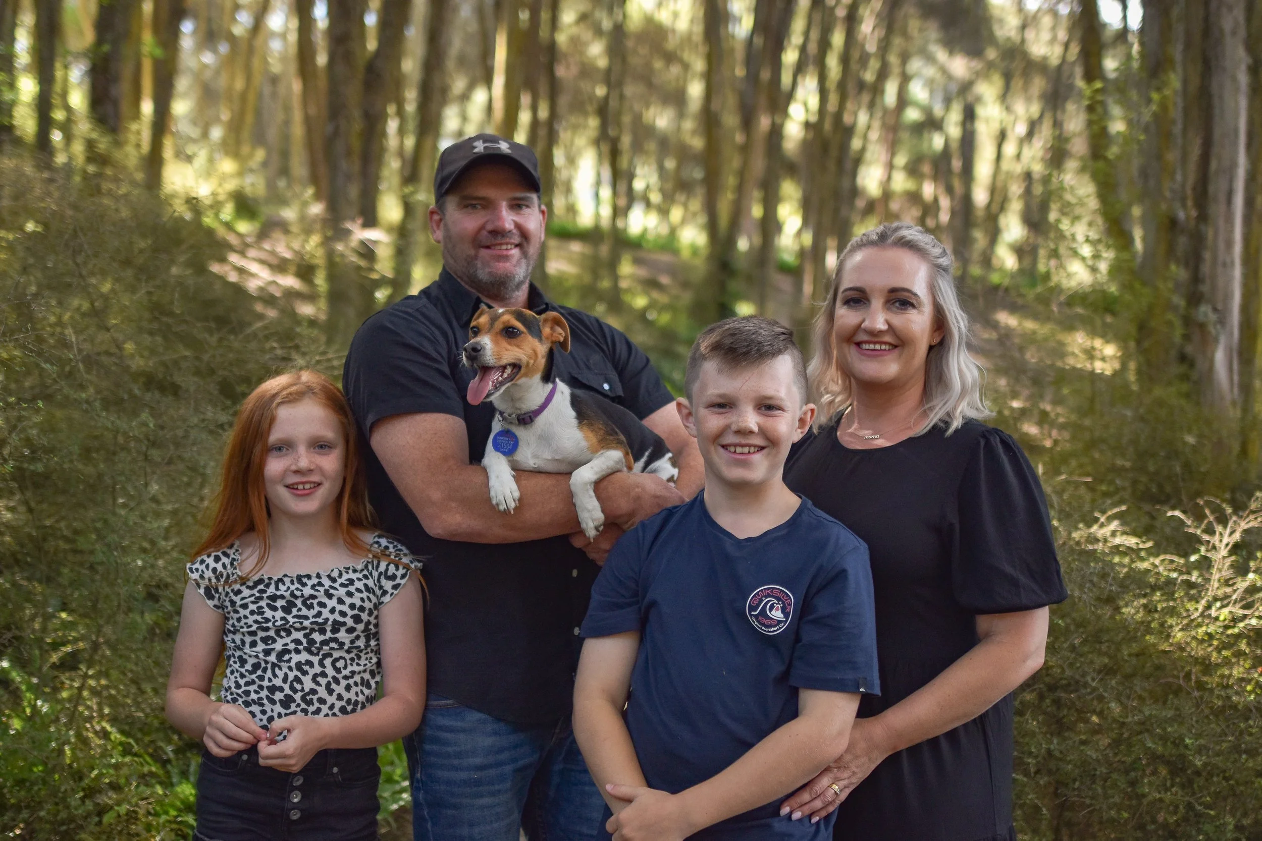 fun natural candid family photography outdoors family of four with a small dog