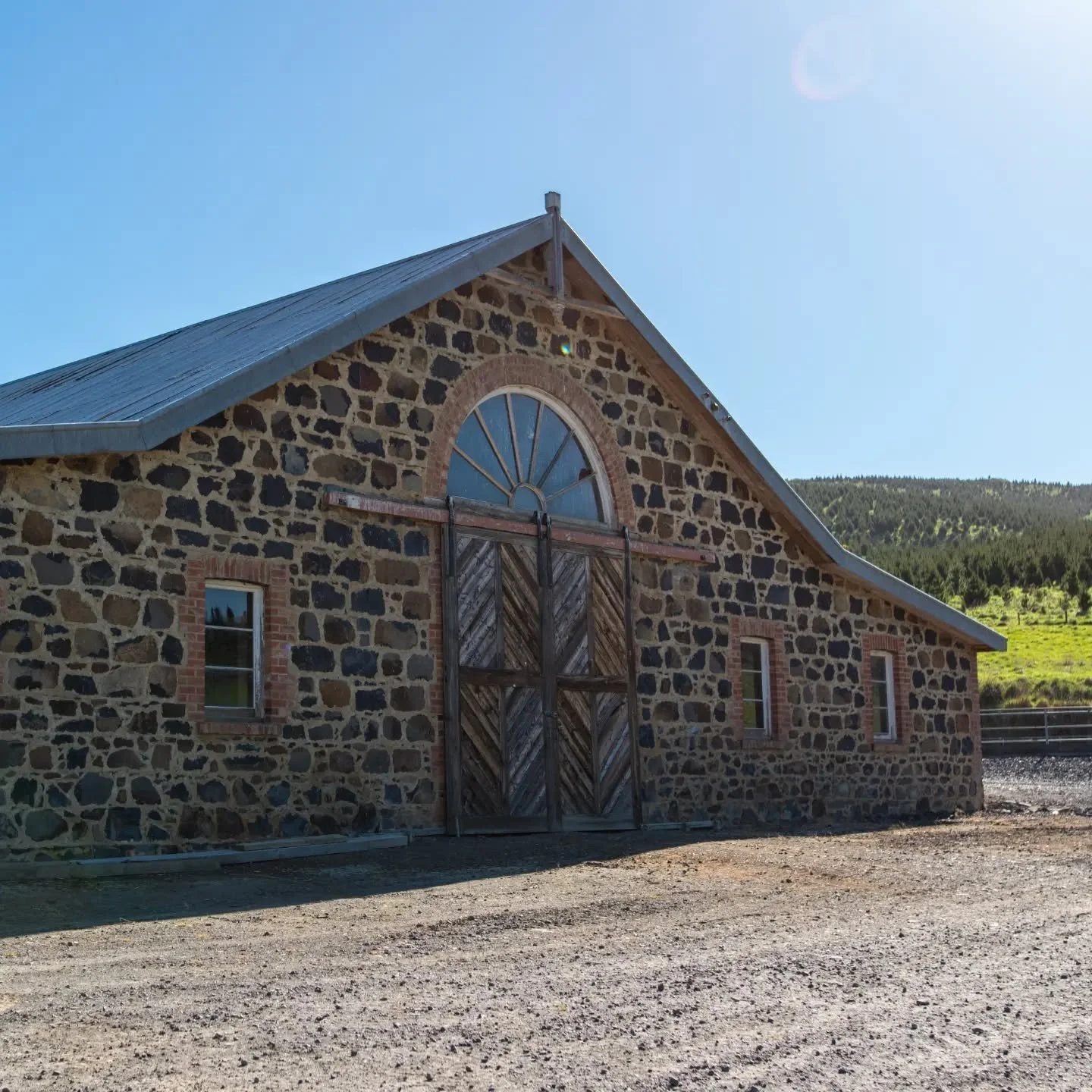 Have a good look at this place, because I want you standing in it.

This is The Stables. Built in 1884 from shaped local stone, with red brick around the doorways and timber joinery made by hand 140 years ago. Tucked away on private farmland, it's qu