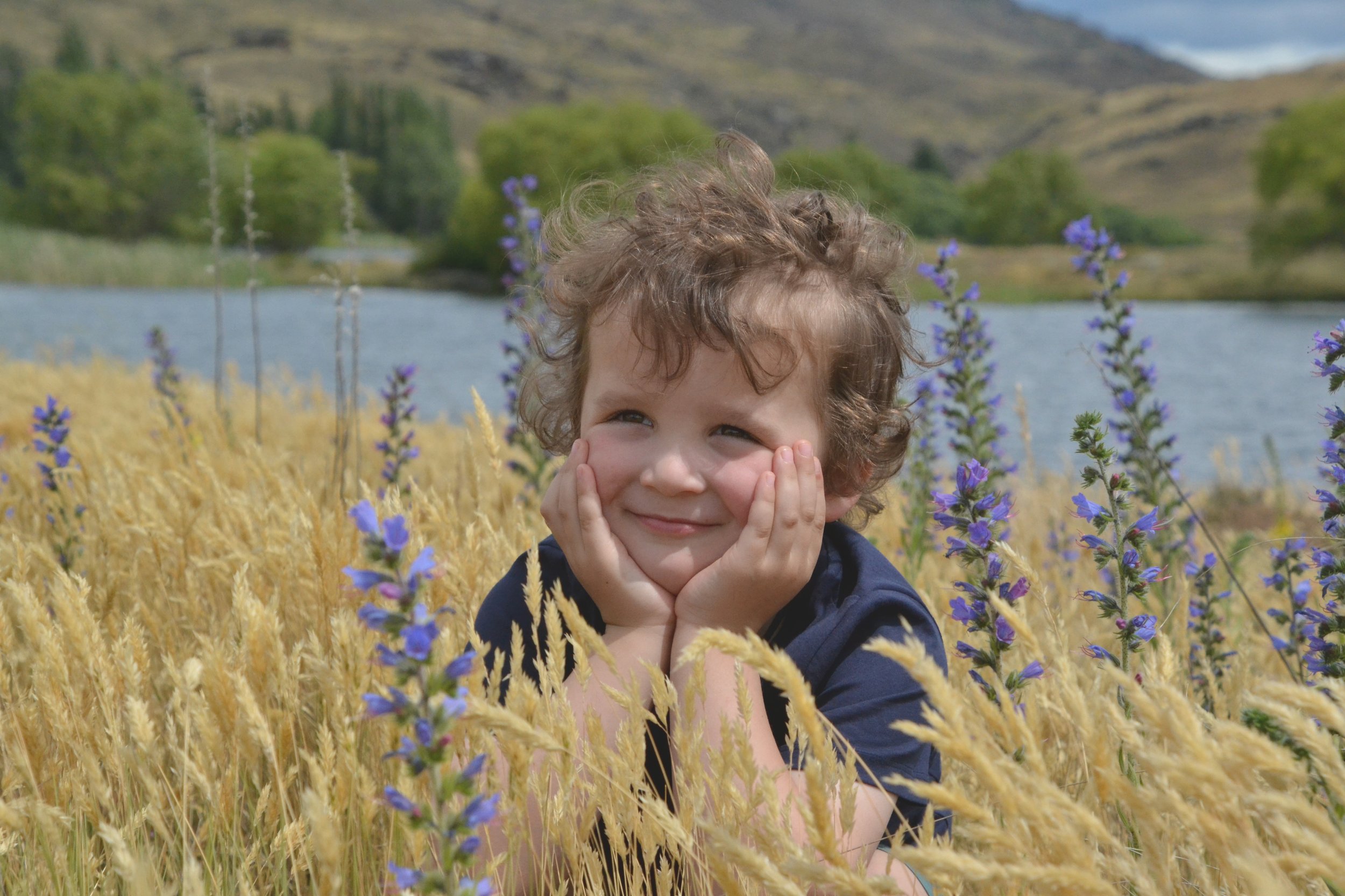 Happy toddler Photography South Island NZ Outdoors Photography. Candid Photography. Professional family Photography Otago region. 