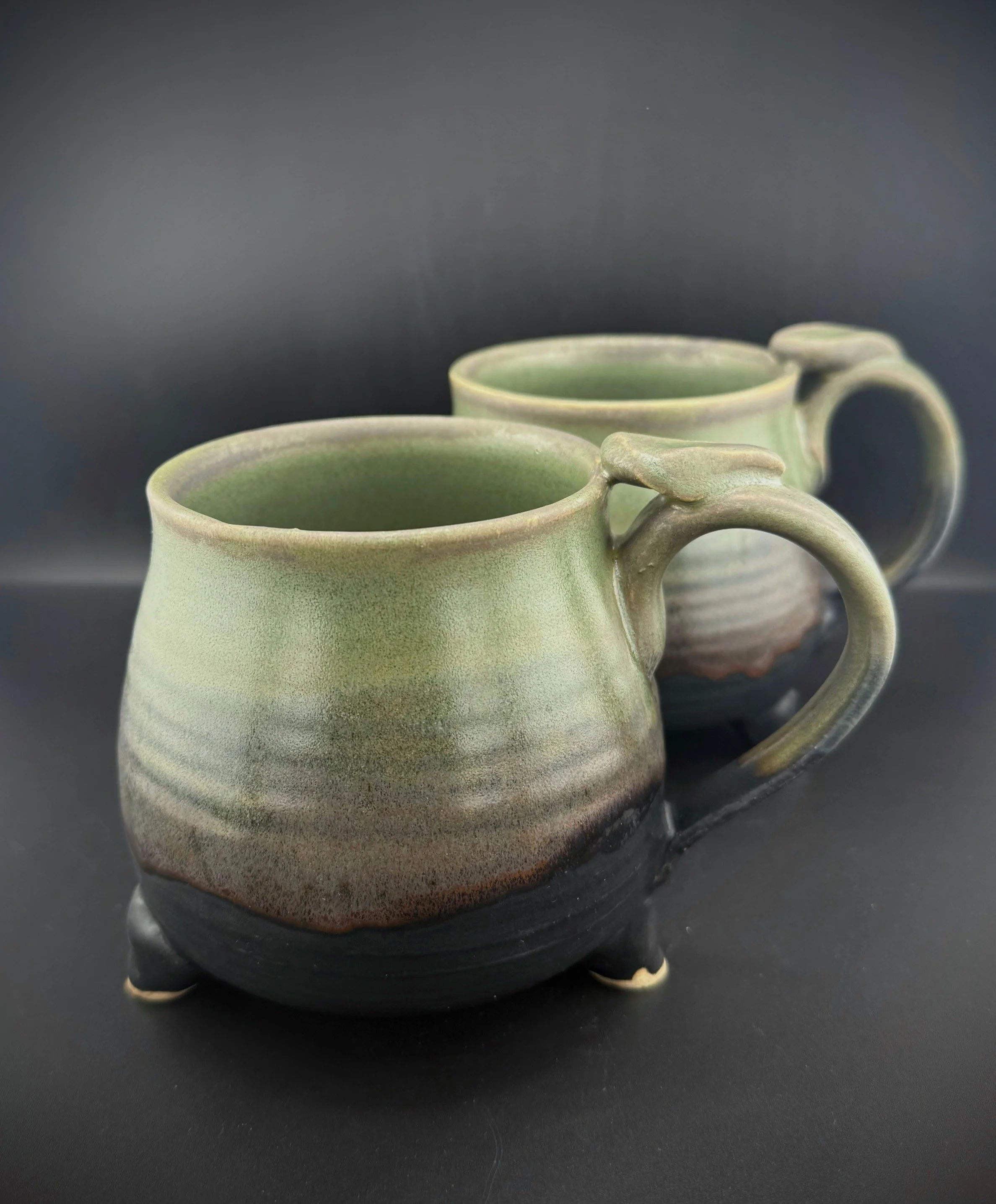 Handmade black and green Cauldron mug