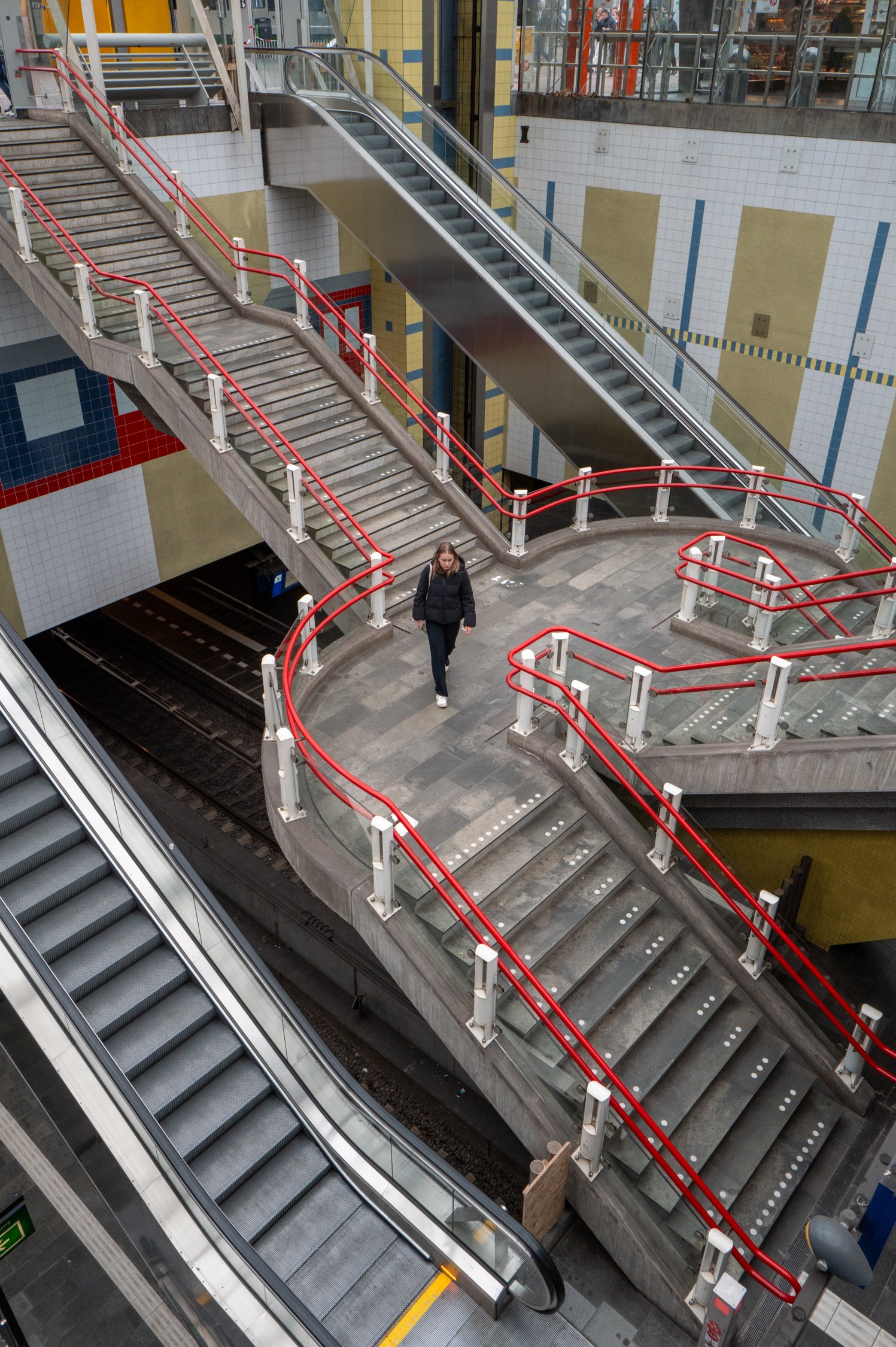 Escalators and stairs in a public transportation station.