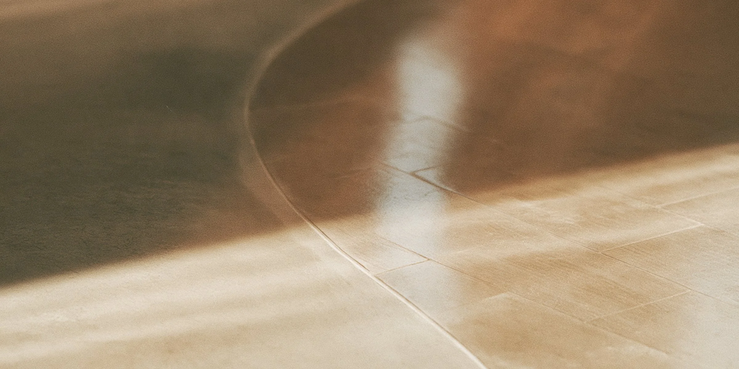 Two paths diverging across a salon floor, one lit and one dark, Big Little Content