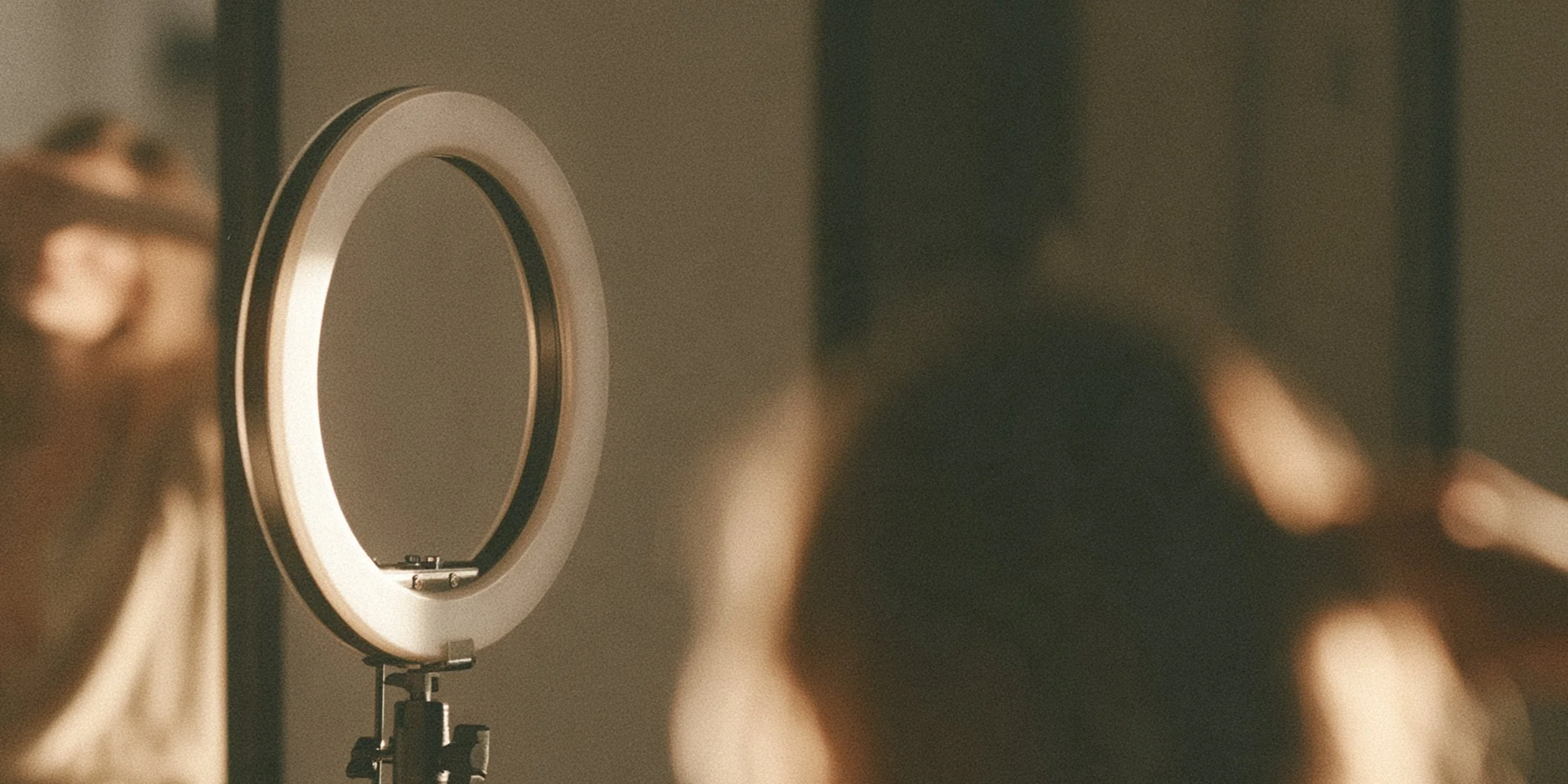Ring light and tripod set up behind a hairdresser filming in a salon, Big Little Content